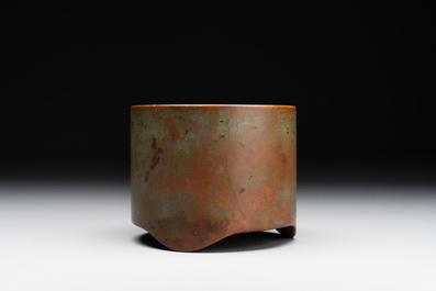 A small Chinese bronze cylindric tripod censer, Xuande mark, Ming