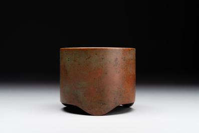 A small Chinese bronze cylindric tripod censer, Xuande mark, Ming