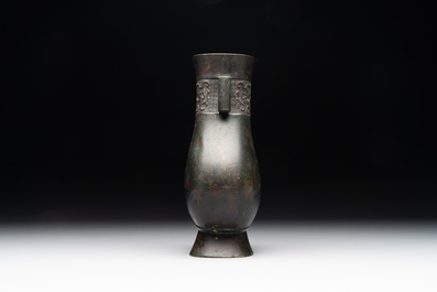 A Chinese silver-inlaid bronze arrow vase with Taotie design, 'touhu 投壺', Ming