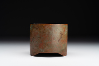 A small Chinese bronze cylindric tripod censer, Xuande mark, Ming