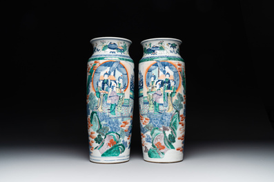A pair of Chinese famille verte rouleau vases with narrative design, 19th C.