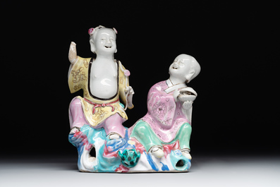 A Chinese famille rose group of Hehe Erxian on wooden stand, Qianlong