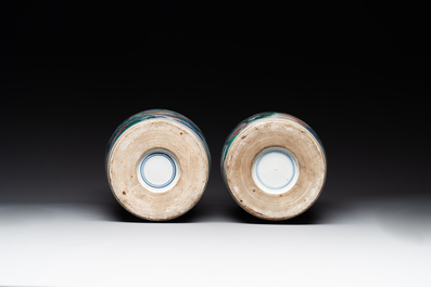 A pair of Chinese famille verte rouleau vases with narrative design, 19th C.