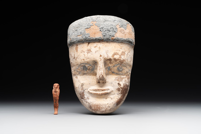 A death mask, a Ushabti, an oil lamp and a ritual cone with hieroglyphs, Egypt, 15th/1st C. B.C.