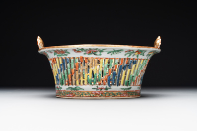 A Chinese Canton famille rose reticulated basket and stand, a bowl and a dish, 19th C.