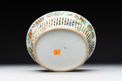 A Chinese Canton famille rose reticulated basket and stand, a bowl and a dish, 19th C.