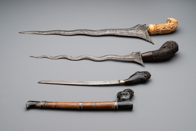 A collection of six krises with carved handles, four with scabbard, Indonesia, 19th C.
