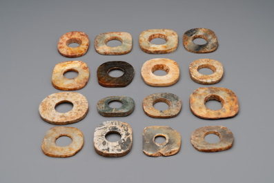 A collection of 16 Chinese neolithic jade 'bi' discs, probably Shang