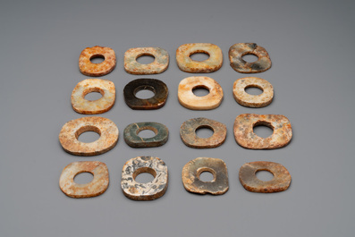 A collection of 16 Chinese neolithic jade 'bi' discs, probably Shang