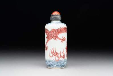 A Chinese blue, white and copper-red snuff bottle with a dragon, dragon mark, 19th C.