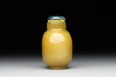 A Chinese yellow jade snuff bottle with moss agate cover and bone stopper, 19th C.