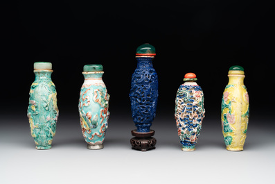 Five Chinese moulded famille rose snuff bottles, Qianlong mark, 19th C.