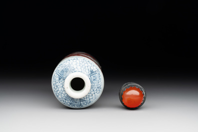 A Chinese blue, white and copper-red snuff bottle with a dragon, dragon mark, 19th C.