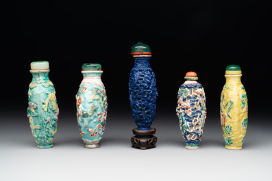 Five Chinese moulded famille rose snuff bottles, Qianlong mark, 19th C.