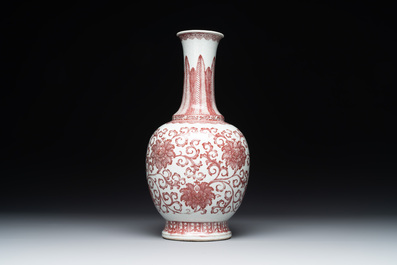 A Chinese copper-red-decorated 'lotus scroll' bottle vase, Qianlong
