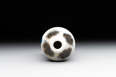 A Chinese blue, white and copper-red 'camel' snuff bottle, dragon mark, 19th C.