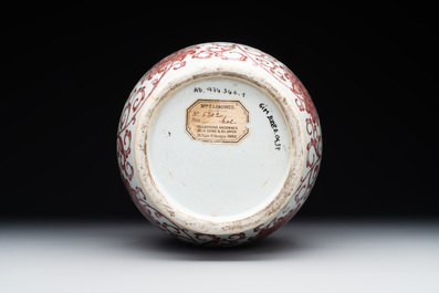 A Chinese copper-red-decorated 'lotus scroll' bottle vase, Qianlong