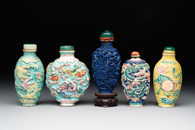 Five Chinese moulded famille rose snuff bottles, Qianlong mark, 19th C.