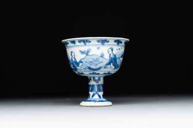 A Chinese blue and white stem cup with scholars in a landscape, Transitional period