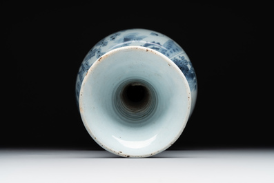 A blue and white Dutch Delft bottle-shaped chinoiserie vase with a lion, 17th C.