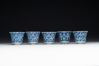 Five fine Chinese blue and white cups and saucers, 19th C.