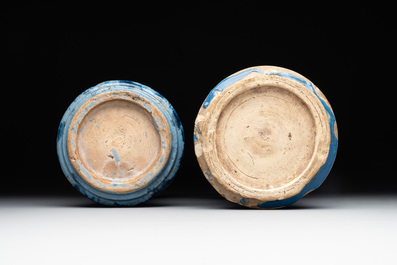 Two large monochrome and splashed blue pottery albarelli, Spain, 17th C.