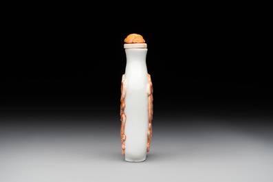 A Chinese moulded iron-red 'chilong' snuff bottle, 19th C.