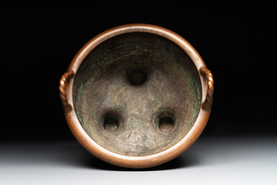A large Chinese bronze tripod censer with two handles, 19th C.