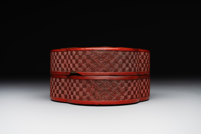 A Chinese quadrifoil red cinnabar lacquer box and cover with figural design, 19/20th C.