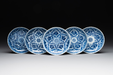 Five fine Chinese blue and white cups and saucers, 19th C.