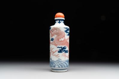 A Chinese blue, white and copper-red 'dragon' snuff bottle, 19th C.
