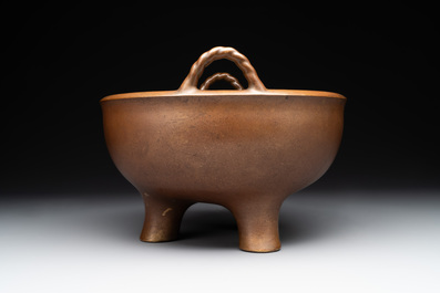 A large Chinese bronze tripod censer with two handles, 19th C.