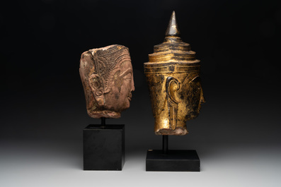 A Thai red sandstone head of Buddha and a lacquered and gilt stone head of Buddha, possibly Ayutthaya period, 15th C.