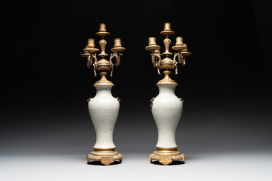 A pair of Chinese blue and white Nanking crackle-glazed vases with gilt bronze candelabra mounts, 19th C.