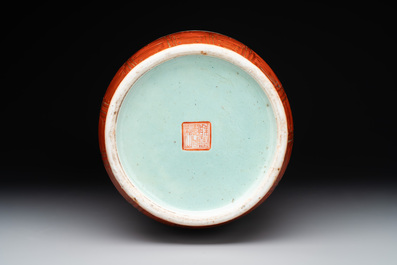 A Chinese famille rose coral-red-ground vase and a famille verte vase, 19th C.