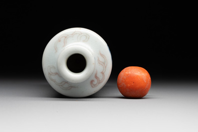 A Chinese blue, white and copper-red 'dragon' snuff bottle, 19th C.