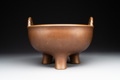 A large Chinese bronze tripod censer with two handles, 19th C.