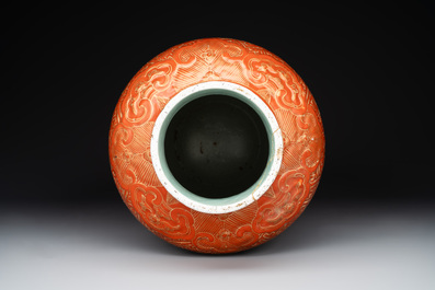 A Chinese famille rose coral-red-ground vase and a famille verte vase, 19th C.