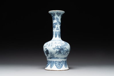 A blue and white Dutch Delft bottle-shaped chinoiserie vase with a lion, 17th C.