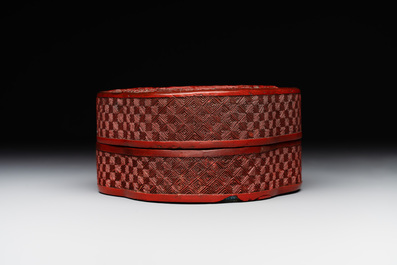A Chinese quadrifoil red cinnabar lacquer box and cover with figural design, 19/20th C.