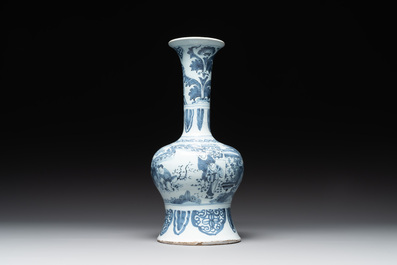 A blue and white Dutch Delft bottle-shaped chinoiserie vase with a lion, 17th C.