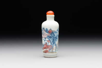 A Chinese blue, white and copper-red 'landscape' snuff bottle, 19th C.