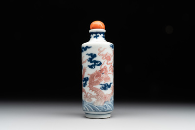 A Chinese blue, white and copper-red 'dragon' snuff bottle, 19th C.