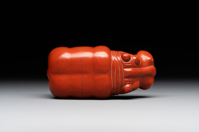 An 18kt gold mounted red jasper hippopotamus with sapphire inset eyes in Faberg&eacute;-style, early 20th C.