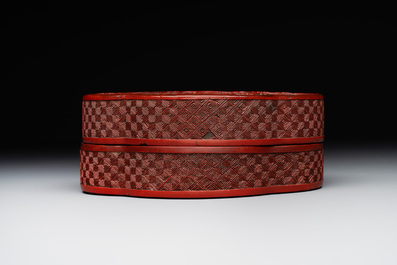 A Chinese quadrifoil red cinnabar lacquer box and cover with figural design, 19/20th C.