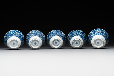 Five fine Chinese blue and white cups and saucers, 19th C.