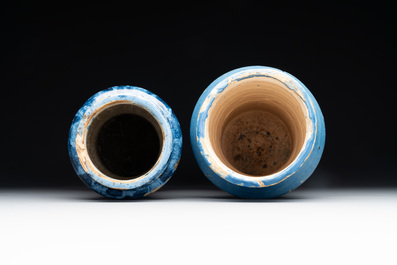 Two large monochrome and splashed blue pottery albarelli, Spain, 17th C.