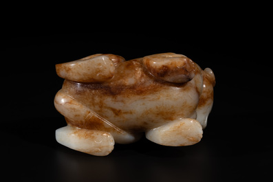 A large Chinese white and russet jade sculpture of a mythical beast, 17/18th C.