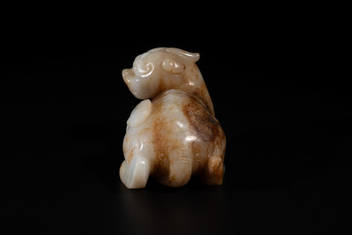 A large Chinese white and russet jade sculpture of a mythical beast, 17/18th C.