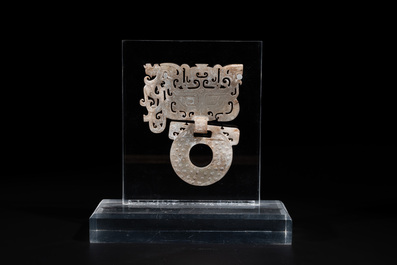 A Chinese nephrite jade 'bi' disc representing a Taotie mask, Han